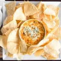 Buffalo Chicken Spinach Dip · Grilled chicken diced and tossed in regular wing sauce and blended with our house made spina...