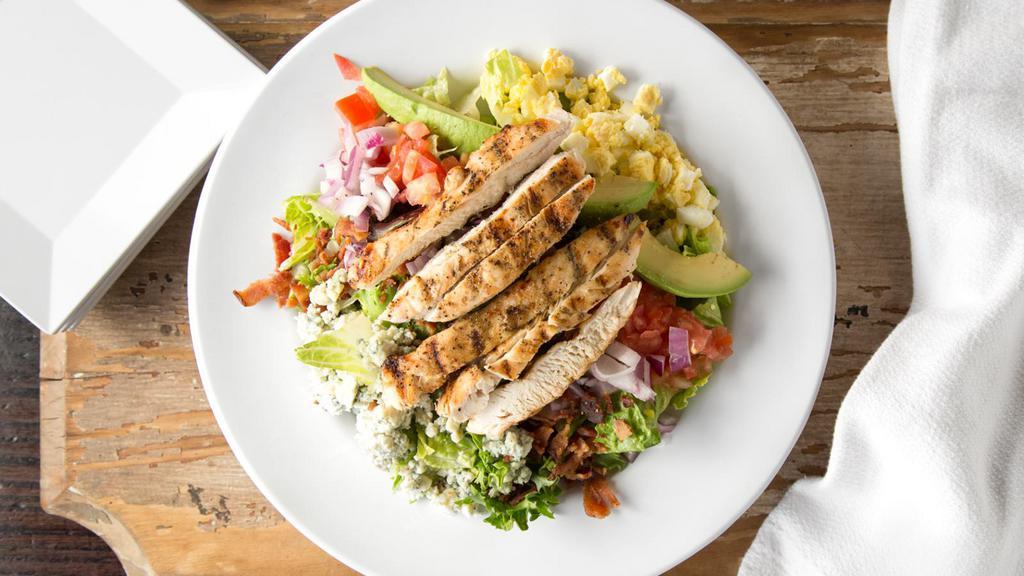 A.T. Cobb · Fresh greens topped with hardboiled eggs, avocado, tomatoes, grilled chicken, red onions, bacon bits, croutons and bleu cheese crumbles. Served with your choice of dressing.