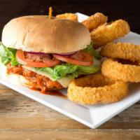 Breaded Buffalo Chicken · Our juicy eight oz chicken breast, breaded and fried to order. Smothered in buffalo sauce an...