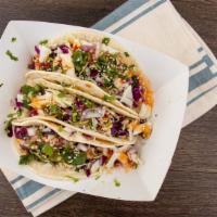 Korean Bbq Tacos · Choice of meat, cabbage, pico, Korean BBQ sauce and sesame seeds and a lime wedge.