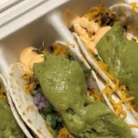 El Scorcho Tacos · Three street style tacos, choice of meat, cheese, onions, cilantro, topped with el scorcho s...