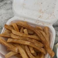 Seasoned Fries · Seasoned crispy fries with a side of el scorcho sauce.