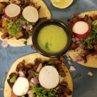 Tacos Al Pastor · (3)pork,pineapple,onions ,radishes and cilantro