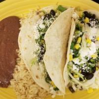 Vegetable Tacos · (2) tacos Make with black beans,corn,onions,cilantro,lettuce and feta cheese served whit ric...