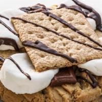 S'More · A chocolate chip cookie with fluffy marshmallows, chocolate candy bar, topped off with a cru...