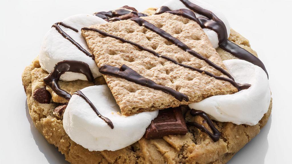 S'More · A chocolate chip cookie with fluffy marshmallows, chocolate candy bar, topped off with a crunchy graham cracker!