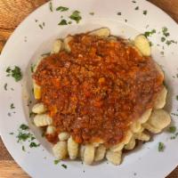 Gnocchi Bolognese · Potato dumplings with meat sauce.
