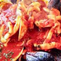 Zuppa Di Pesce · Shrimp, calamari, mussels and clams in a light red sauce served over pasta.