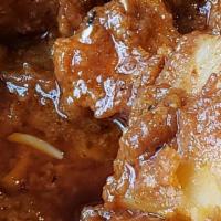 Lamb Vindaloo · Tender juicy lamb pieces marinated in vinegar and Indian spices cooked in simmering style wi...