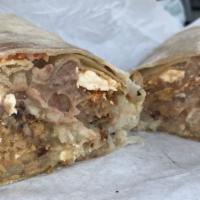 Hash Brown Breakfast Burrito · Eggs, hash browns, bacon, sausage, beans, and cheese.