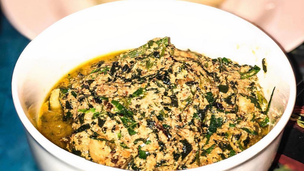 Egusi Soup · Grounded pumpkin seeds, cooked with spinach.