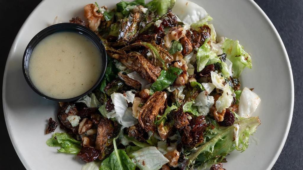 Brussel Sprout Salad · Flash fried brussel sprouts, spring mix, iceberg lettuce, walnuts, cherries, bleu cheese all tossed in honey mustard.