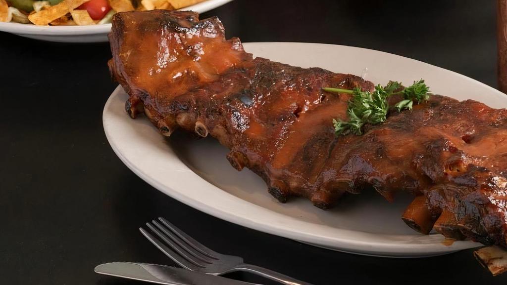 Whole Slab Rib Dinner · Slow cooked on our rotisserie until cooked to perfection. Served with loaf of bread choice of side and coleslaw.