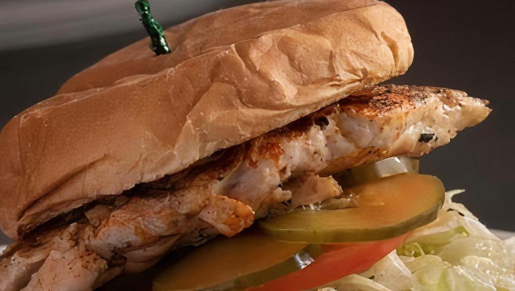 Chicken Sandwich · Topped with lettuce, tomato and pickles. With choice of one side and coleslaw.