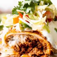 Steak Burrito · Steak and refried beans rolled up in a flour tortilla, topped with cheese, lettuce, tomatoes...