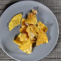 Cheese Nachos · Chips with cheese and a variety of toppings.