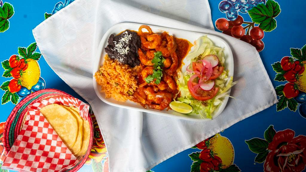 Camarones A La Diabla · Hot. Grilled shrimp with onions, covered with hot diabla sauce, served in a sizzling plate with spanish rice, refried beans and tortillas.