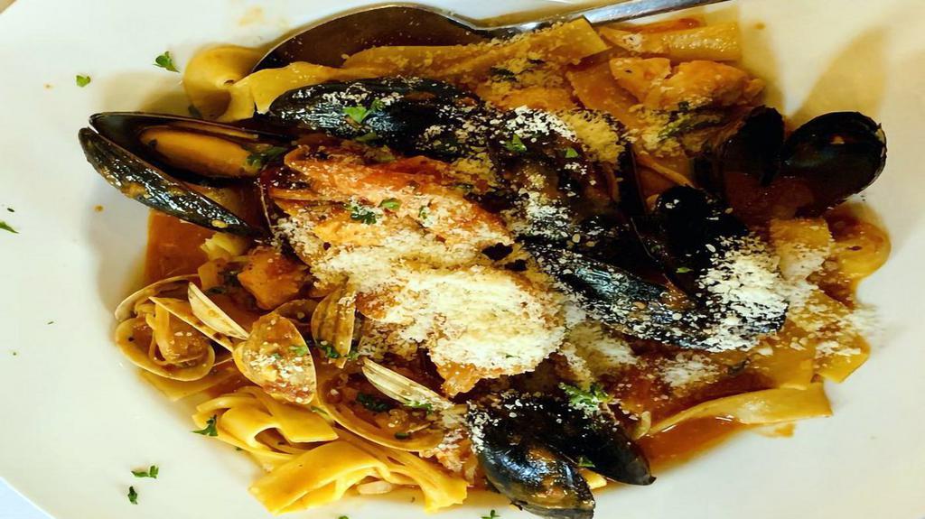 Fruitti Di Mare Fra Diavolo · Mussels, baby clams, shrimp, scallop and fresh fish, spiced pomodoro and imported De Cecco spaghettini.
