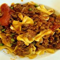 Farfalle Alla Zooma · Handmade bowtie pasta, housemade spicy sausage, green peas, shallots and garlic pomodoro.