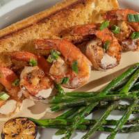 Grilled Shrimp W/ Garlic Butter · Grilled jumbo shrimp served with crispy garlic toast, fresh asparagus, and seafood garlic bu...