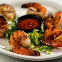Grilled & Chilled Shrimp · Jumbo shrimp are seasoned, chargrilled and chilled. Served with our housemade cocktail sauce...