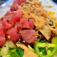 Spicy Poke Tuna* · Spicy yellowfin tuna, romaine lettuce, cucumber, mango, Japanese seaweed salad, jalapeños, g...
