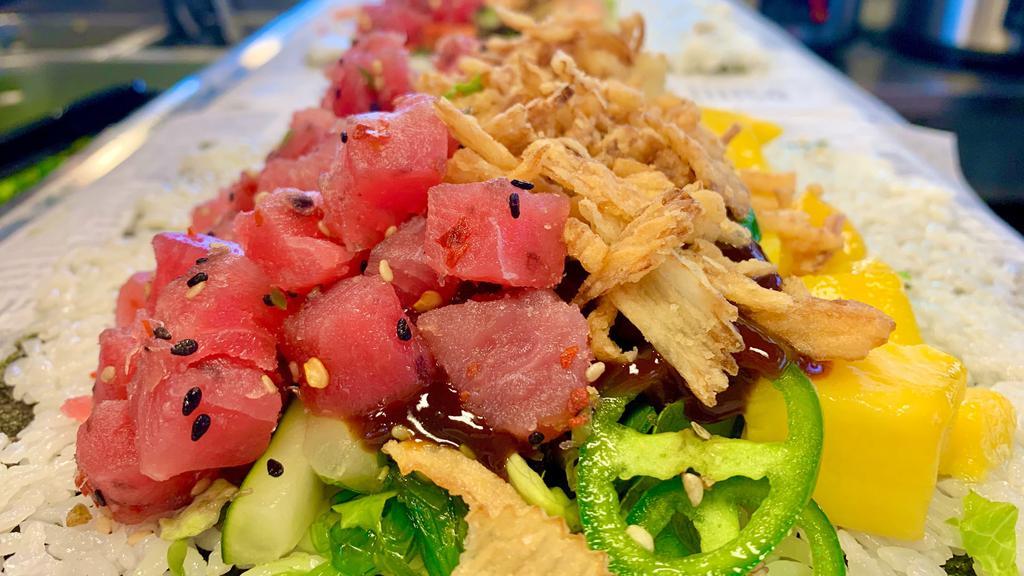 Spicy Poke Tuna* · Spicy yellowfin tuna, romaine lettuce, cucumber, mango, Japanese seaweed salad, jalapeños, green onions, crispy onions & spicy teriyaki.