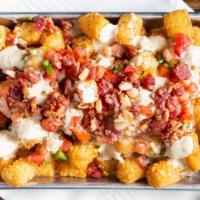 Loaded Tots · Queso, pico, chopped bacon and jalapeño ranch.