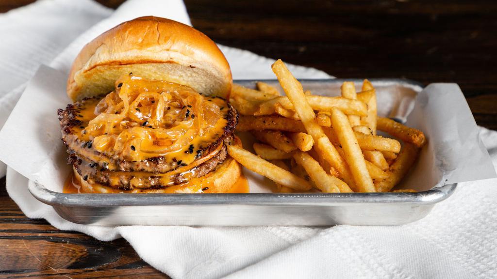 The Social Burger · Social Sauce, caramelized onions and smoked gouda on a toasted brioche bun.