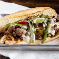 Kc Cheesesteak · Grilled philly steak meat, jalapeños, grilled onions, red and green peppers, mushrooms and s...