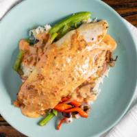 Northeast Blackened Fish · With fish with cilantro lime rice and seasonal veggies topped with a spicy ranch.