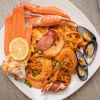 Loaded Cajun Pasta · Fettuccine noodles, Shrimp, Mussels, Snow Crab, and Louisiana Sausage wrapped in homemade Ca...