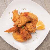 Wing Plate (6) · Deep-fried wings tossed in your favorite spices. Served with Cajun Fries. 
Flavors: Cajun, H...