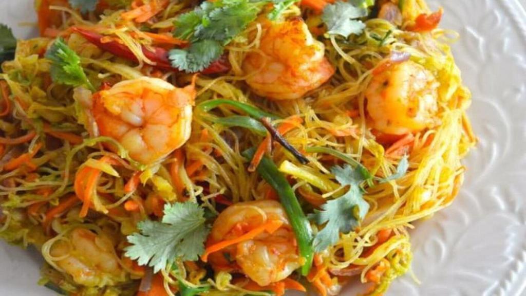 Singapore Mai Fun · Spicy. Thin rice noodle pan stir fried with curry, five flavor seasoning, shredded vegetables, chicken, pork and shrimps.
