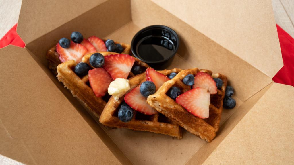 Belgian Waffle (Gluten Free) · A delicious gluten free Belgian waffle topped with fresh blueberries, strawberries, butter, and 100% pure maple syrup.

1