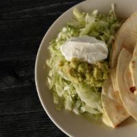 Mucho Queso · Two grilled flour tortillas filled with cheese. Served with lettuce, guacamole and sour cream.