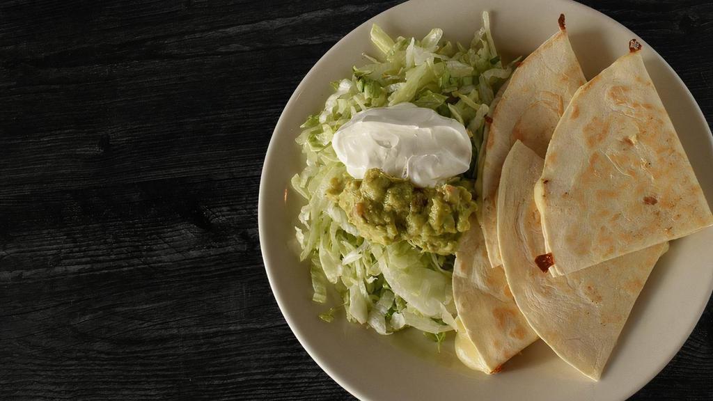 Mucho Queso · Two grilled flour tortillas filled with cheese. Served with lettuce, guacamole and sour cream.