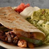 Fajita Quesadilla · Your choice of steak or chicken in a huge flour tortilla filled with onions, peppers, Ranche...