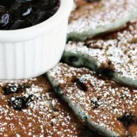 Blueberry Pancakes · Freshly made blueberry batter stacks up to Six(6) perfect pancakes dusted with powdered suga...