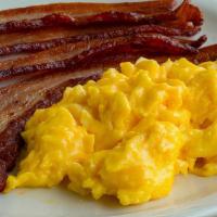 Diced Ham And Eggs · Three(3) eggs lightly scrambled with diced honey maple ham, served with Three(3) buttermilk ...