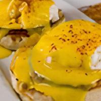 Eggs Benedict · A toasted English Muffin topped with Canadian Bacon, Two(2) poached eggs and our homemade Ho...