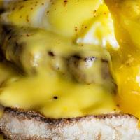Eggs Michael · A toasted English Muffin topped with sausage patties, Two(2) poached eggs, and our Hollandai...