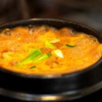 Seafood Dwen Jang Jjigae · Spicy bean paste stew with mixed seafood and vegetables. Served with side dishes and rice.