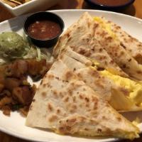 Quesadillas · A large flour tortilla stuffed with cheddar and jack cheeses then grilled crispy. Served wit...