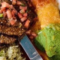 Coyote Combo · A chicken enchilada and our famous carne asada served with red rice, refried beans, sour cre...