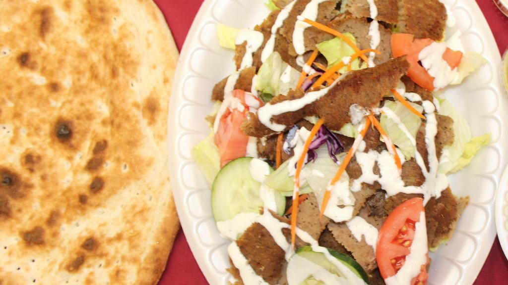 Gyro Salad · Combination of beef and lamb delicately spiced and served with fresh tandoori bread.