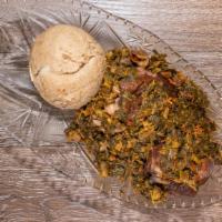 Efo Riro · Nigerian style leafy green soup server with choice of meat and swallow.