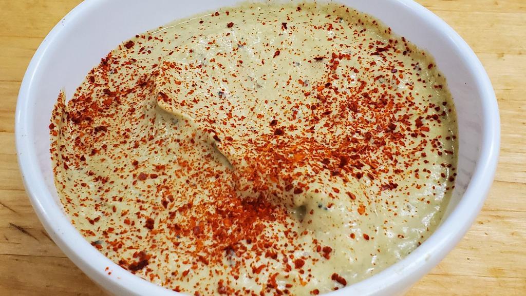 Jalapeño  Hummus Spicy 8Oz · Our legendary hummus with roasted jalapeños. A must try.