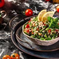 Tabbouleh · Chopped parsley, mint,tomato, cracked wheat, tossed with lemon juice and olive oil.