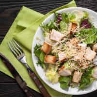 Caesar Salad · Crisp romaine lettuce and herb croutons tossed with caesar-dressing and parmigiano..